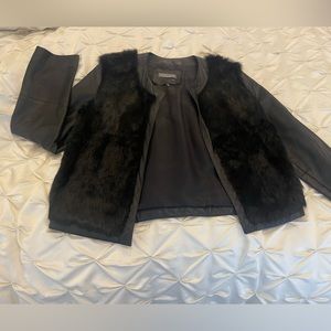 Beautiful leather and fur mixed jacket. Perfect for the holiday season!